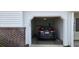 Attached garage featuring a car inside and storage racks at 182 Wimbledon Way # 182, Murrells Inlet, SC 29576