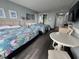 Cozy bedroom with two beds and a dining table with access to other amenities at 201 74Th Ave. N # 2549/2550, Myrtle Beach, SC 29577