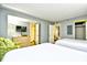 Bedroom with two beds and a dresser with a TV at 201 74Th Ave. N # 2549/2550, Myrtle Beach, SC 29577