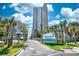 Sand Dunes Resort with beautiful landscaping and views of the blue skies and lush palm trees at 201 74Th Ave. N # 2549/2550, Myrtle Beach, SC 29577