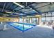 Inviting indoor pool with ocean views, plenty of seating, and natural light at 201 74Th Ave. N # 2549/2550, Myrtle Beach, SC 29577