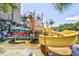 Fun waterpark area with slides, splash features, and tropical palms at 201 74Th Ave. N # 2549/2550, Myrtle Beach, SC 29577