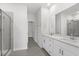 Bright bathroom featuring double vanity, a glass-enclosed shower and tile floors at 2020 Copper Creek Loop, Longs, SC 29568