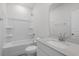 Bright bathroom with a tub, shower, and modern vanity at 2020 Copper Creek Loop, Longs, SC 29568