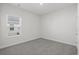 Neutral bedroom with soft carpet, a window and natural light at 2020 Copper Creek Loop, Longs, SC 29568