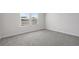 Bright bedroom featuring carpet flooring and a large window at 2020 Copper Creek Loop, Longs, SC 29568