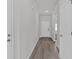 Interior hallway view featuring hard surface floors, trim, and neutral paint at 2020 Copper Creek Loop, Longs, SC 29568