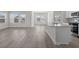 An open-concept layout featuring a kitchen with modern appliances and an island with gray countertops at 2020 Copper Creek Loop, Longs, SC 29568
