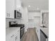 Modern kitchen featuring white cabinets, stainless steel appliances, and light countertops at 2020 Copper Creek Loop, Longs, SC 29568