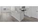Kitchen featuring stainless steel appliances, gray backsplash, a quartz countertop island, and white cabinets at 2020 Copper Creek Loop, Longs, SC 29568