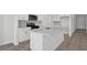 The kitchen features quartz countertops, stainless steel appliances, and white cabinets for a modern touch at 2020 Copper Creek Loop, Longs, SC 29568