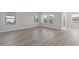 An open living room area filled with natural light and hard surface floors, perfect for gatherings at 2020 Copper Creek Loop, Longs, SC 29568