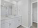 Elegant bathroom with double vanity, quartz countertop, and contemporary fixtures at 2044 Copper Creek Ct., Longs, SC 29568
