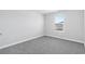 Cozy bedroom with natural light, plush carpeting, and a relaxing atmosphere at 2044 Copper Creek Ct., Longs, SC 29568