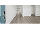 Inviting entryway featuring wood-look floors, leading into a bright, open-concept home at 2044 Copper Creek Ct., Longs, SC 29568