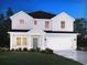 Charming two-story home featuring a welcoming front porch and a two-car garage at 2044 Copper Creek Ct., Longs, SC 29568