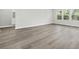 Bright living room with wood-look floors and natural light from the nearby window at 2044 Copper Creek Ct., Longs, SC 29568