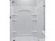 White fiberglass shower with built-in shelves at 2044 Copper Creek Ct., Longs, SC 29568