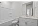 This is a bathroom with white walls and cabinets, plus a shower-tub and tile floor at 2052 Copper Creek Ct., Longs, SC 29568