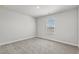 This is a bedroom with neutral walls and carpet, plus a window with blinds at 2052 Copper Creek Ct., Longs, SC 29568