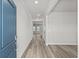 Light-filled foyer featuring wood-look flooring, neutral walls, and a view into the home's open layout at 2052 Copper Creek Ct., Longs, SC 29568