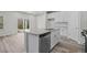 Stylish kitchen with a stainless steel dishwasher and granite countertops on a center island at 2052 Copper Creek Ct., Longs, SC 29568