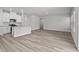 Open-concept living room and kitchen area with modern finishes and recessed lighting at 2052 Copper Creek Ct., Longs, SC 29568