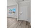 Bright living room showcasing wood-look flooring, natural light from a window, and neutral paint at 2052 Copper Creek Ct., Longs, SC 29568
