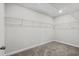 Walk-in closet features neutral carpeting, a light and wire shelving at 2052 Copper Creek Ct., Longs, SC 29568
