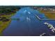 Picturesque aerial view showcasing a river, docks, boat traffic, and marshland at 2104 Copper Creek Ct., Longs, SC 29568