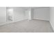 Spacious bedroom featuring neutral carpet and an attached bathroom for added convenience at 2104 Copper Creek Ct., Longs, SC 29568