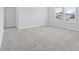 Bright bedroom featuring a window, plush carpeting, and easy access to other rooms at 2104 Copper Creek Ct., Longs, SC 29568