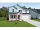 Inviting two-story home boasting a well-maintained lawn and a two car garage at 2104 Copper Creek Ct., Longs, SC 29568