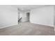 Open hallway with neutral walls and carpet, leading to multiple rooms in the home at 2104 Copper Creek Ct., Longs, SC 29568