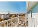 View from condo balcony of the neighborhood, with houses and tropical foliage at 212 58Th Ave. N # 1C, North Myrtle Beach, SC 29582