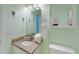 Well-lit bathroom with granite countertop, framed mirror, and seashell decor at 212 58Th Ave. N # 1C, North Myrtle Beach, SC 29582