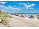 Picturesque beach scene with vibrant umbrellas, lounge chairs, and clear blue skies offering a perfect day by the ocean at 212 58Th Ave. N # 1C, North Myrtle Beach, SC 29582