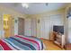 Bright bedroom featuring striped bedding, closet space and natural light at 212 58Th Ave. N # 1C, North Myrtle Beach, SC 29582