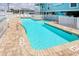 Inviting swimming pool with clear blue water, brick accents, and comfortable lounge area for relaxation by the water at 212 58Th Ave. N # 1C, North Myrtle Beach, SC 29582
