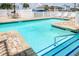 Serene swimming pool featuring crisp blue water, tile accents, and cozy seating for a refreshing and relaxing experience at 212 58Th Ave. N # 1C, North Myrtle Beach, SC 29582