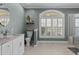 Bright bathroom with white cabinetry, a toilet, and natural light at 2325 Highway 111, Little River, SC 29566