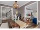Dining room featuring a wooden table set, a chandelier, and a view into the modern kitchen at 2325 Highway 111, Little River, SC 29566