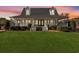 Gorgeous home with a welcoming porch and manicured lawn, creating an inviting atmosphere and curb appeal at 2325 Highway 111, Little River, SC 29566