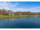 Beautiful two-story home boasts manicured lawns, a front porch, a pond, and a water fountain at 2325 Highway 111, Little River, SC 29566
