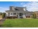 Charming two-story home with a manicured lawn and covered porch invites relaxation and comfort at 2325 Highway 111, Little River, SC 29566