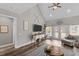Inviting living room with vaulted ceiling, comfortable sofa, and view of the backyard at 2325 Highway 111, Little River, SC 29566