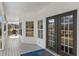 Inviting covered porch with white railings, ample seating, and stylish accents creating an ideal outdoor living space at 2325 Highway 111, Little River, SC 29566