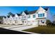 Charming townhome exteriors featuring white siding, blue shutters, and individual driveways at 2333 Elowen Ln. # 10B, Longs, SC 29568