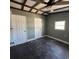 This bedroom features a ceiling fan, two closets, and a window for natural lighting at 237 Charles Rd., Marion, SC 29571