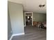 View of a room with fresh paint and new flooring looking into the kitchen at 237 Charles Rd., Marion, SC 29571